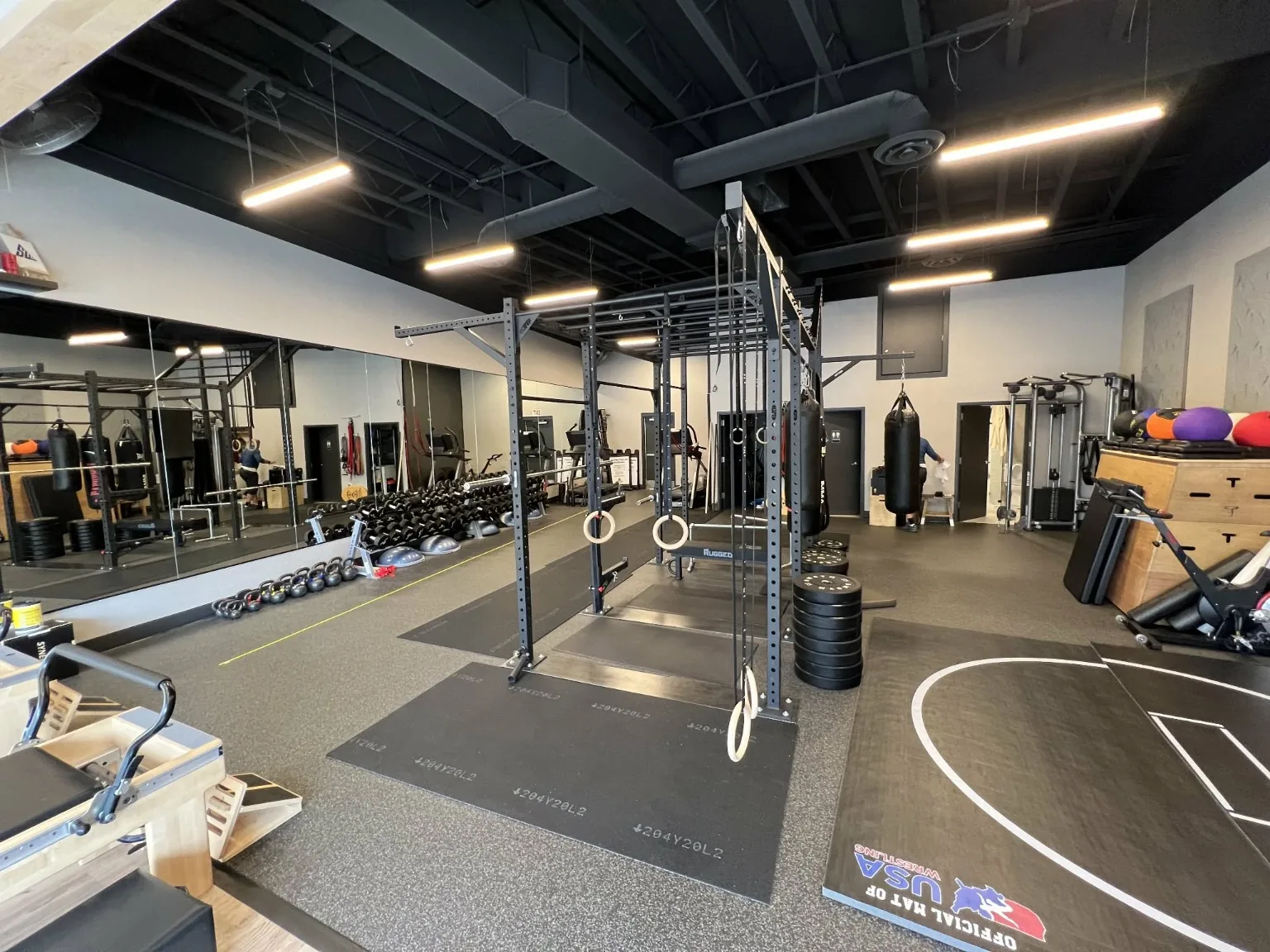The warm wood floor and open training space at the Specialized Fitness studio
